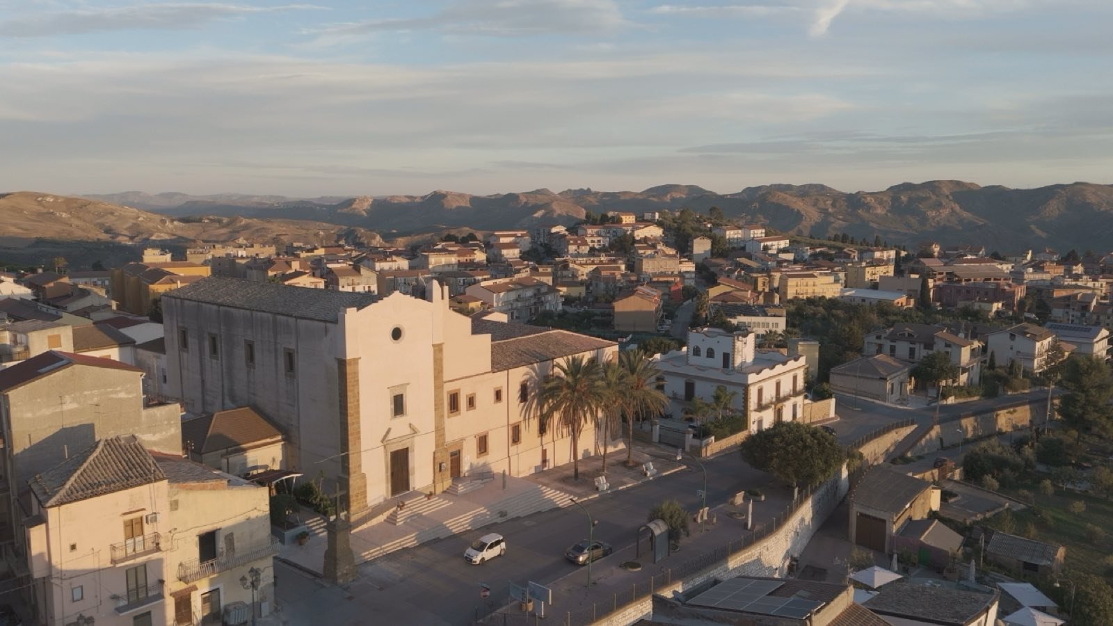 Aerial view of a Sicilian hill town at golden hour