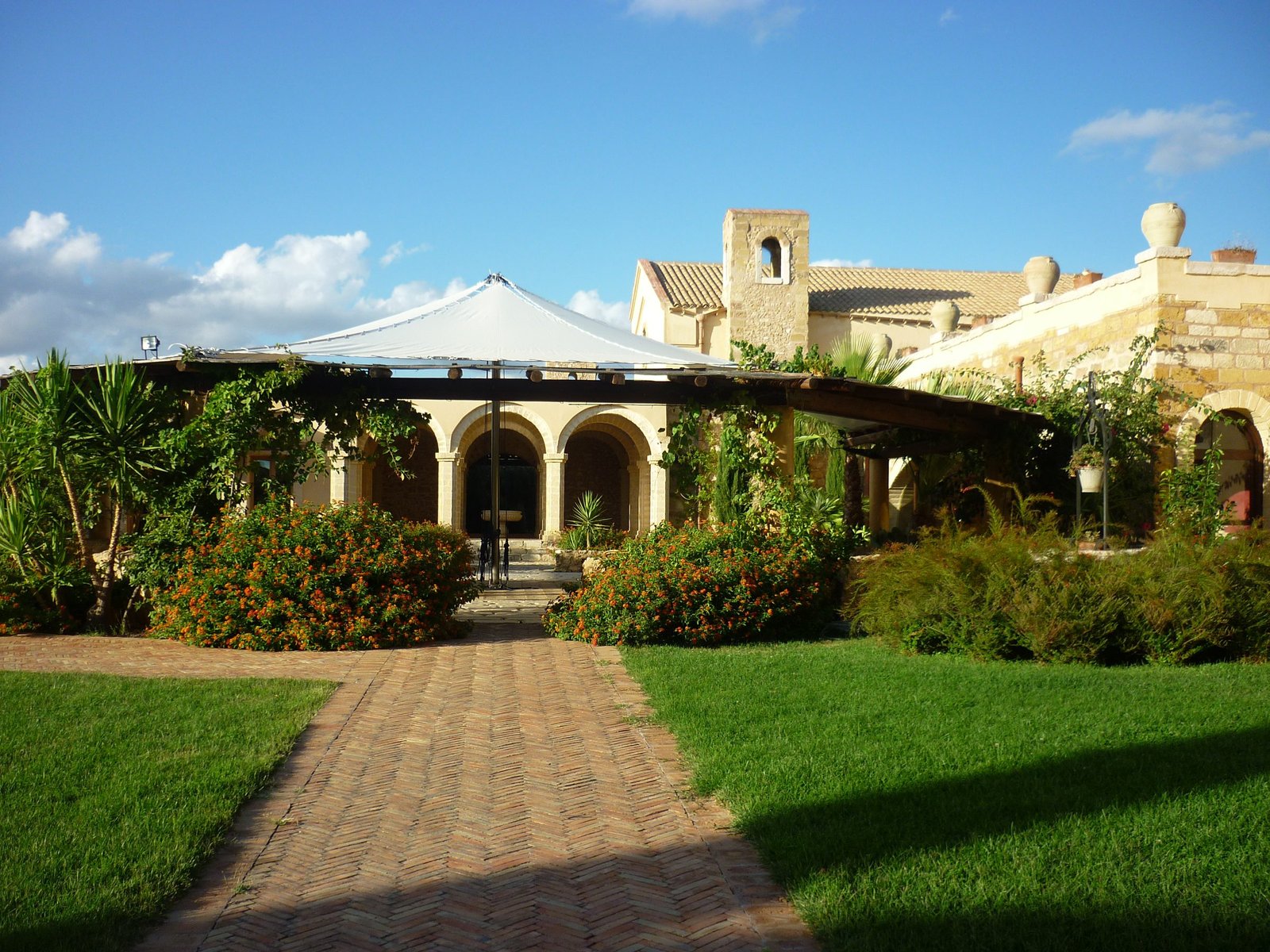 Garden path to a restored Sicilian baglio estate