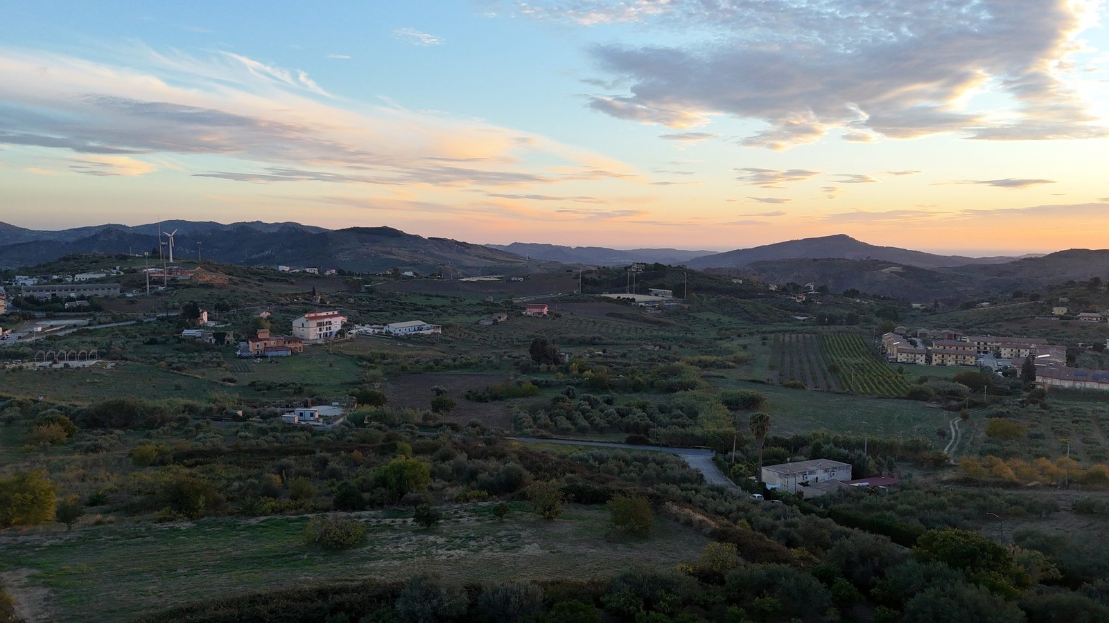Aerial view of a Sicilian hill town at golden hour